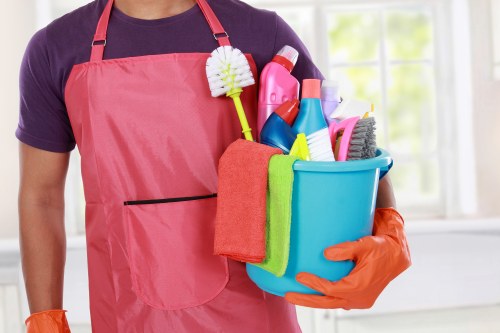 Cleaner preparing a TW9 kitchen for new occupants